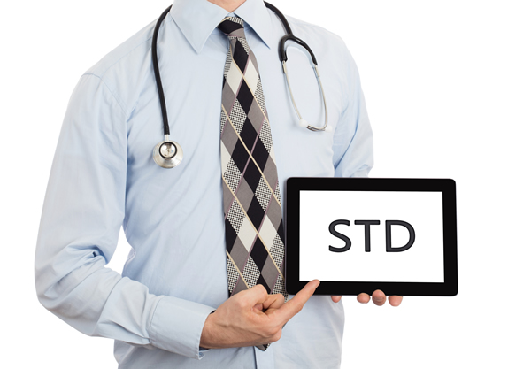 Doctor Holding STD Sign