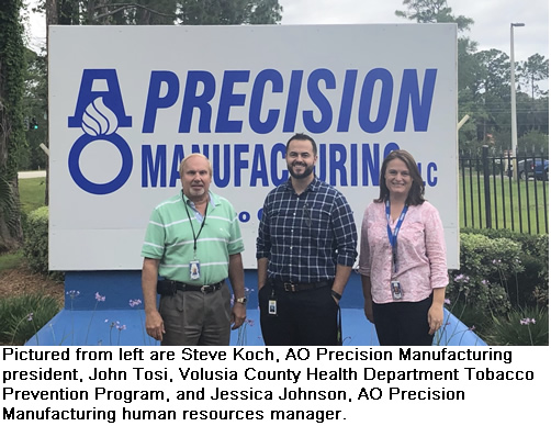 Pictured from left are Steve Koch, AO Precision Manufacturing president, John Tosi, Volusia County Health Department Tobacco Prevention Program, and Jessica Johnson, AO Precision Manufacturing human resources manager. 