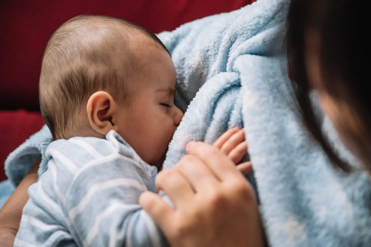 Mother breastfeeding her child